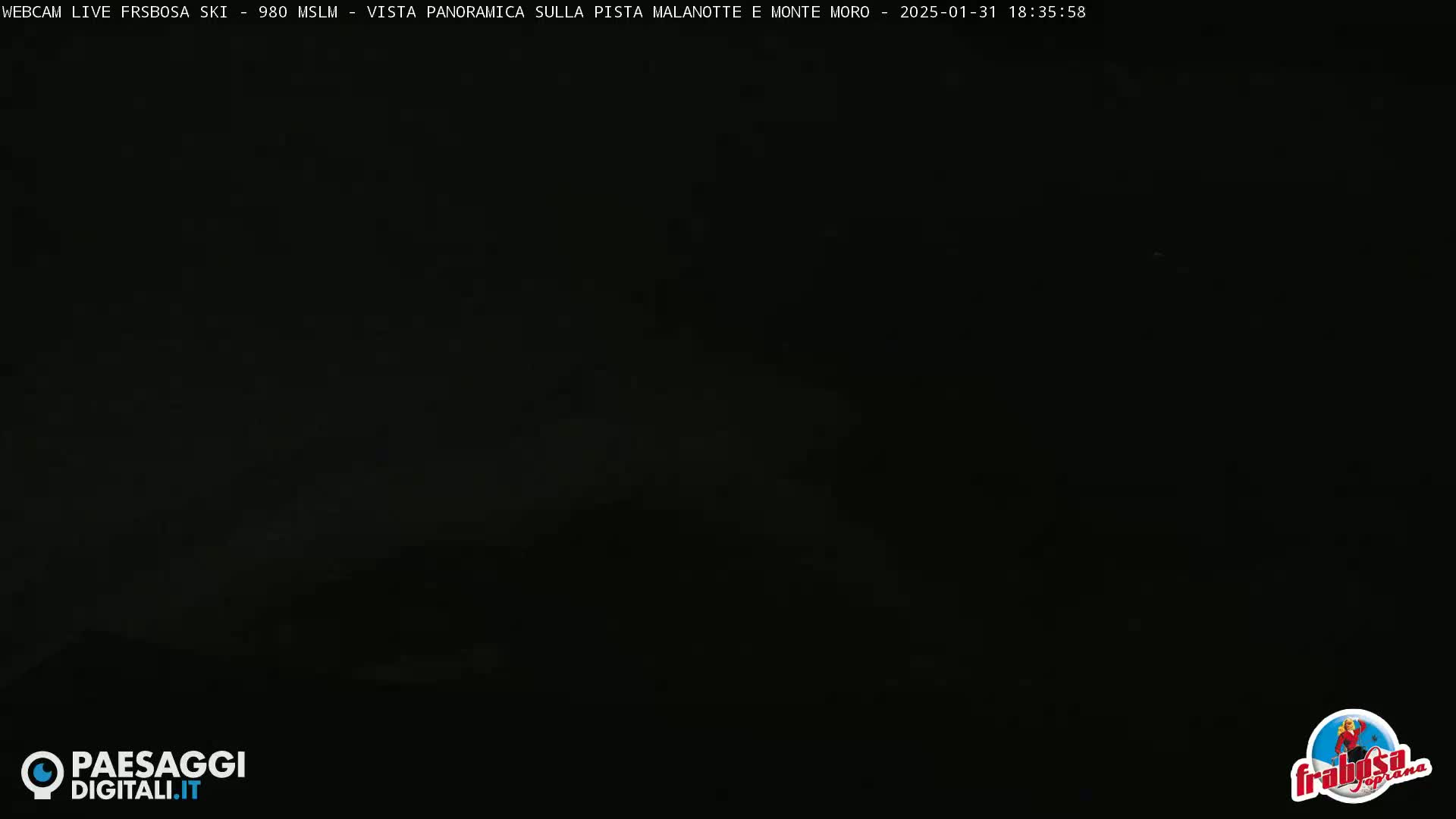 A very dark nighttime outdoor scene is shown.