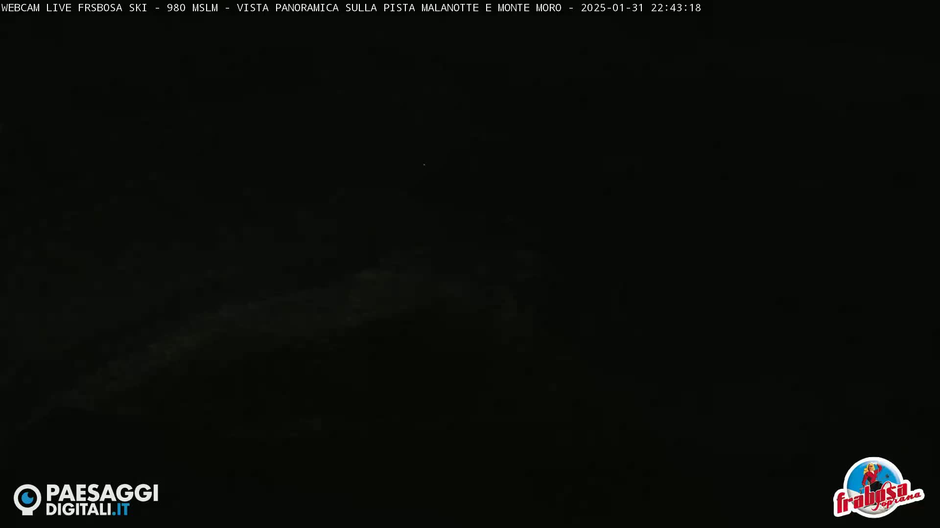 A dark, nighttime scene with faint, light gray clouds or haze visible in the distance.