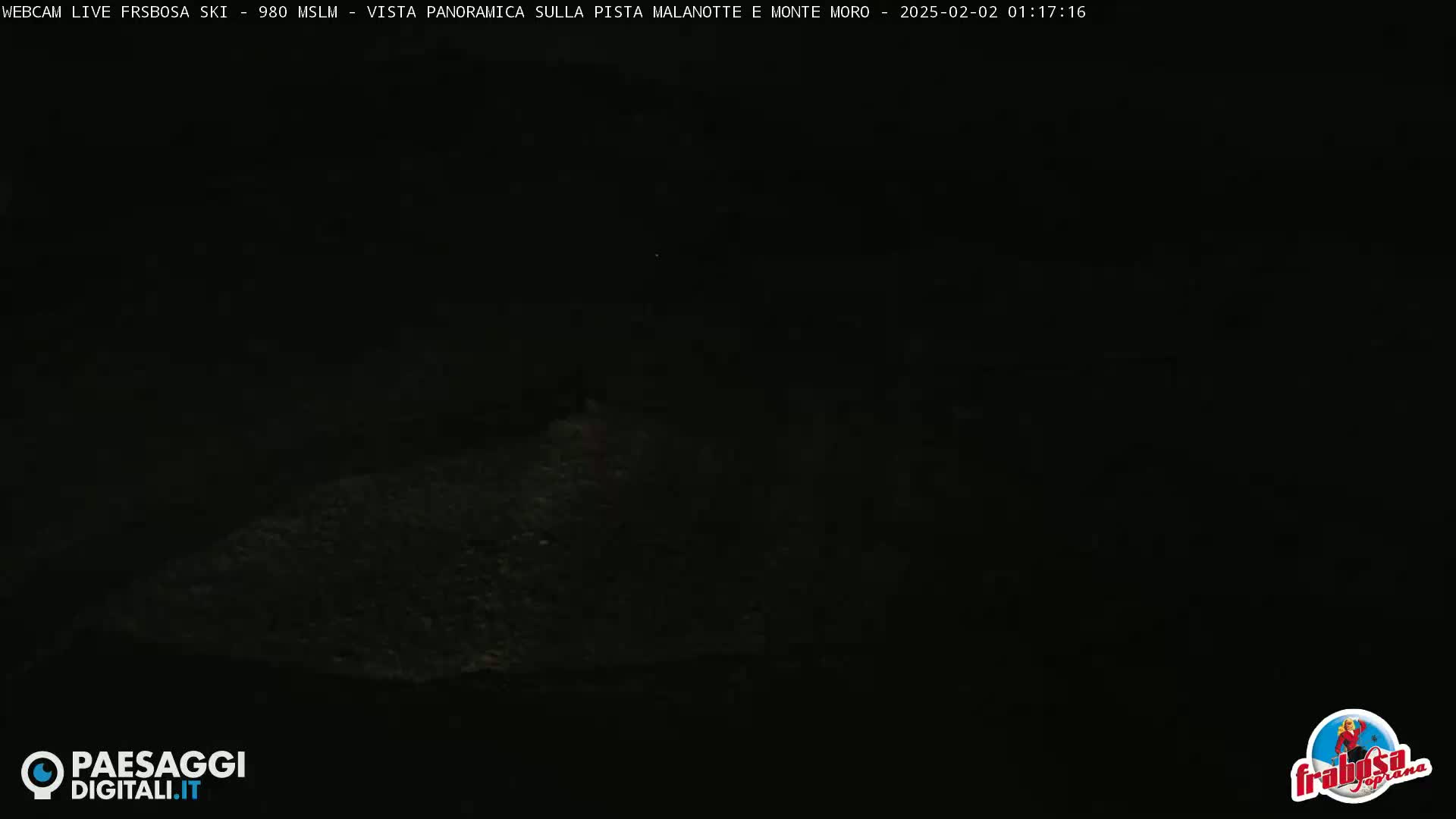 A dark, nighttime outdoor scene shows a mostly obscured landscape.