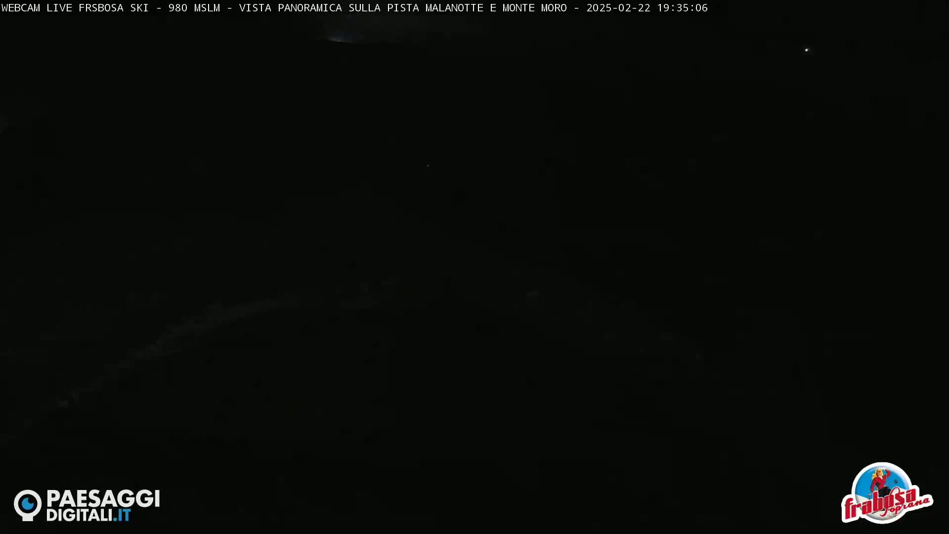 A completely dark nighttime scene is visible, possibly an outdoor shot with minimal light pollution.
