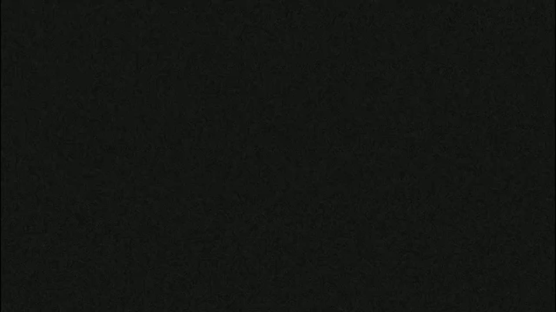 The image is a solid dark-gray or black textured background.
