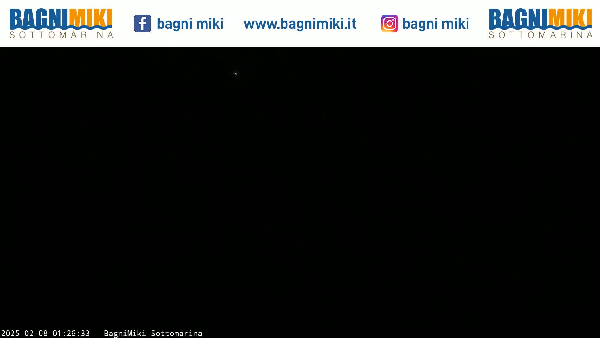 A very dark image shows a single faint light in a nighttime sky.