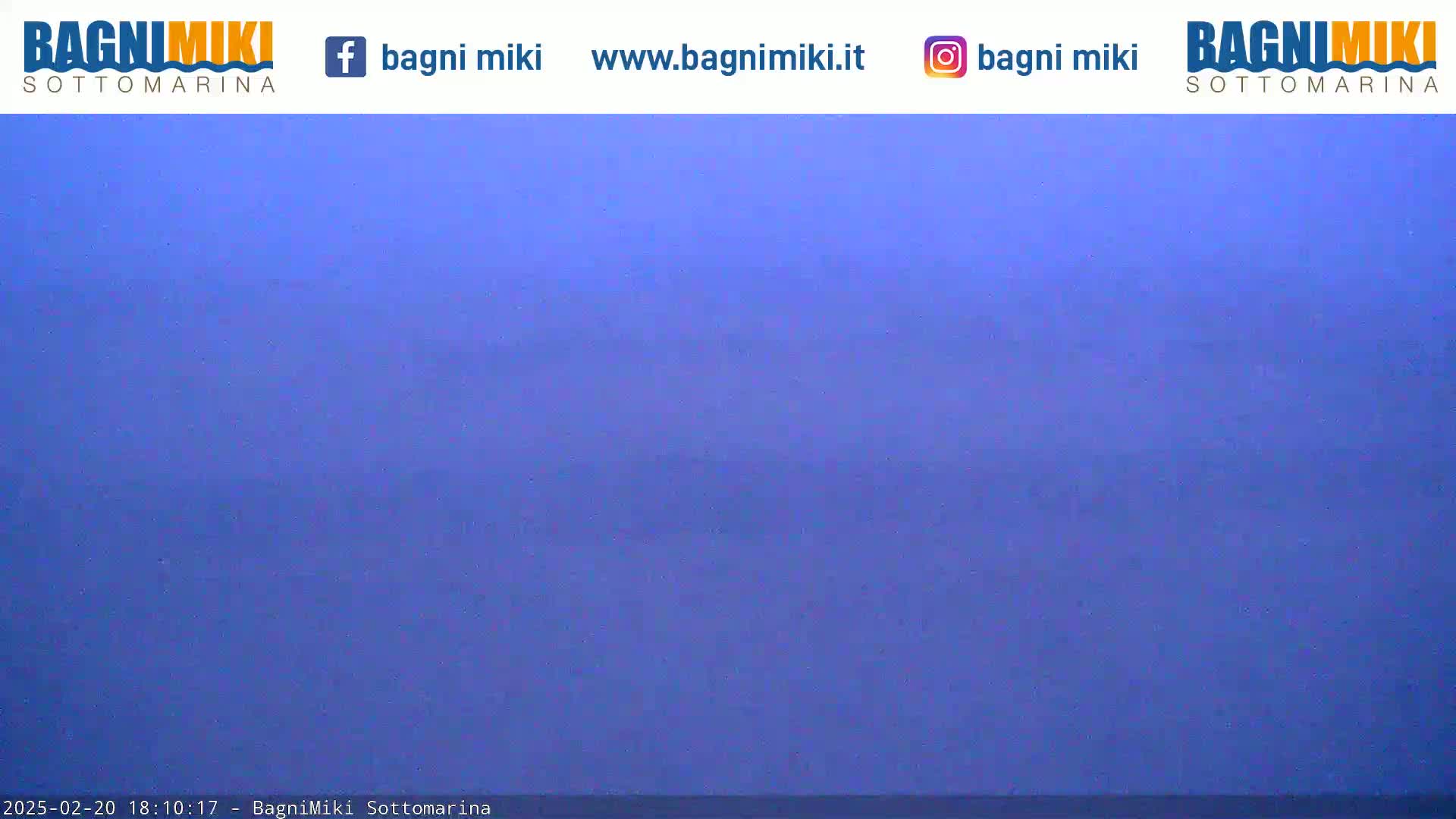 A mostly clear, dusky blue sky is visible.