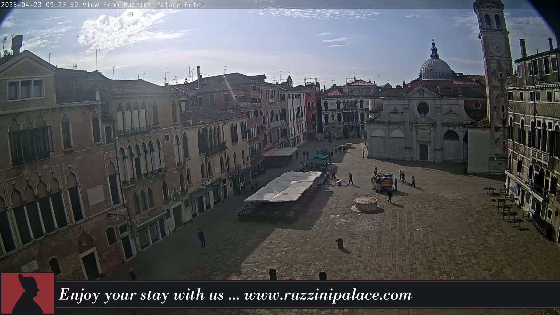 A sunny day reveals a large, mostly empty plaza in Venice, Italy, surrounded by historic buildings.