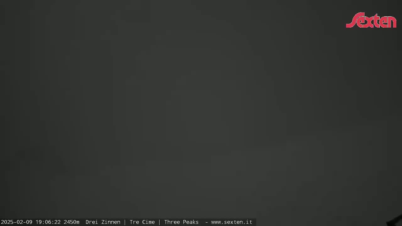 The image shows a uniformly dark gray, overcast sky.
