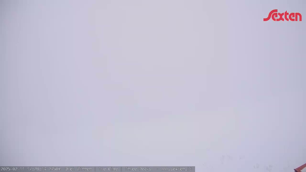 A solid, light-grey, featureless expanse fills the image under overcast conditions.
