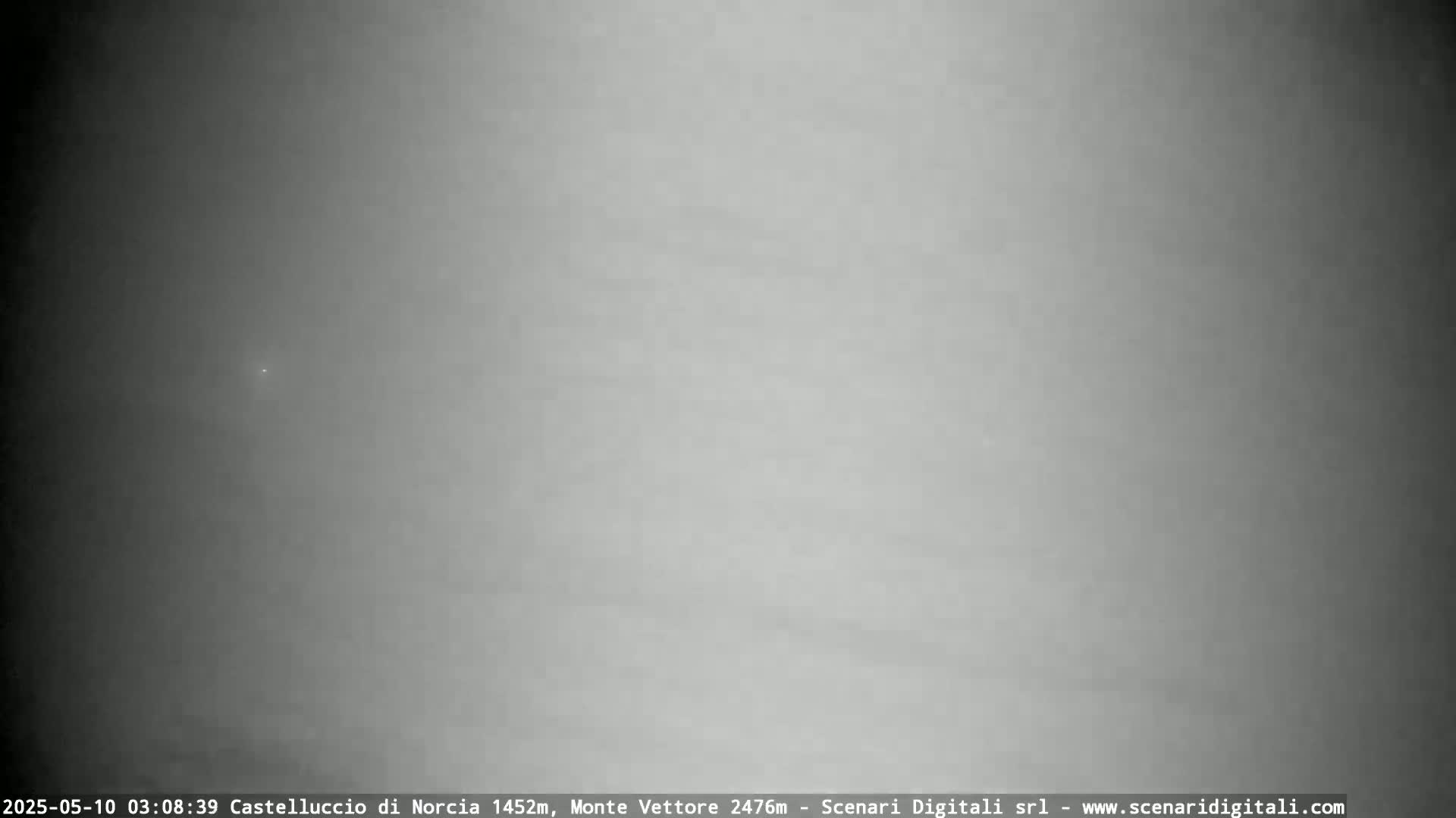 A hazy, gray sky is visible.