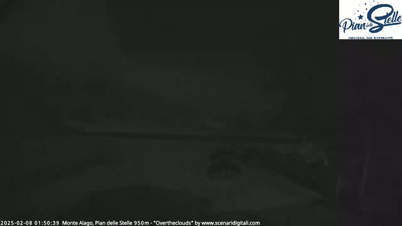 A dark, nighttime outdoor scene is obscured by heavy fog or mist.