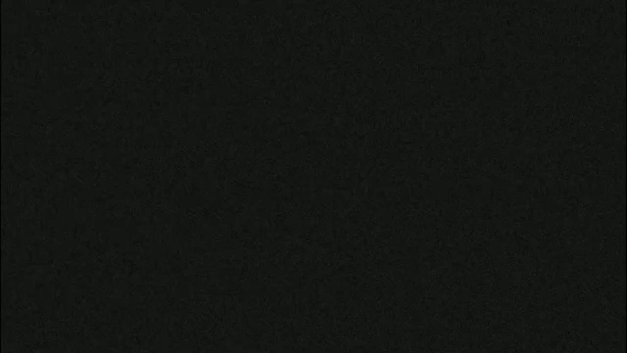 The image shows a uniformly dark gray-black textured surface.