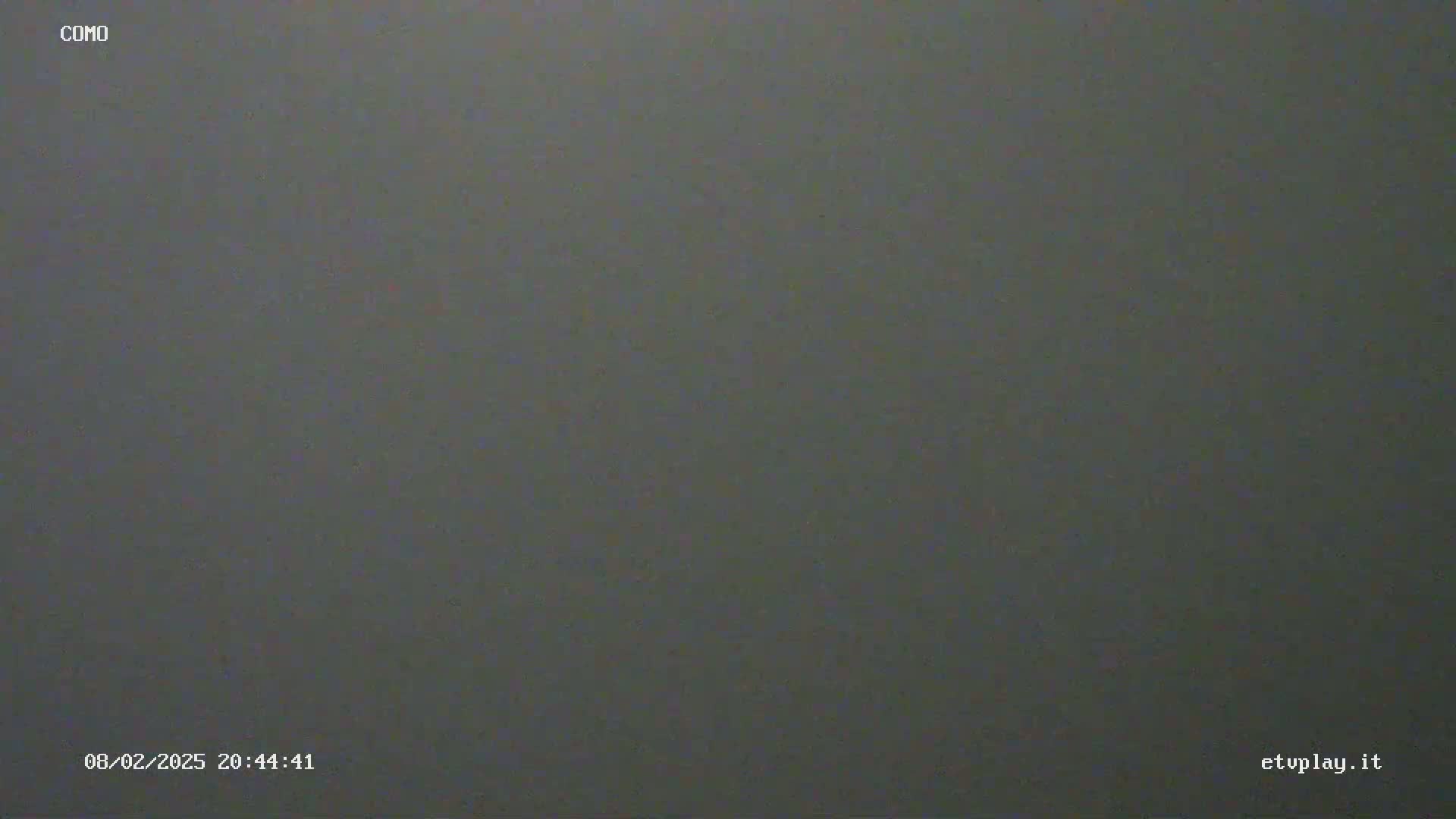 A uniformly dark gray image shows a solid, featureless surface.