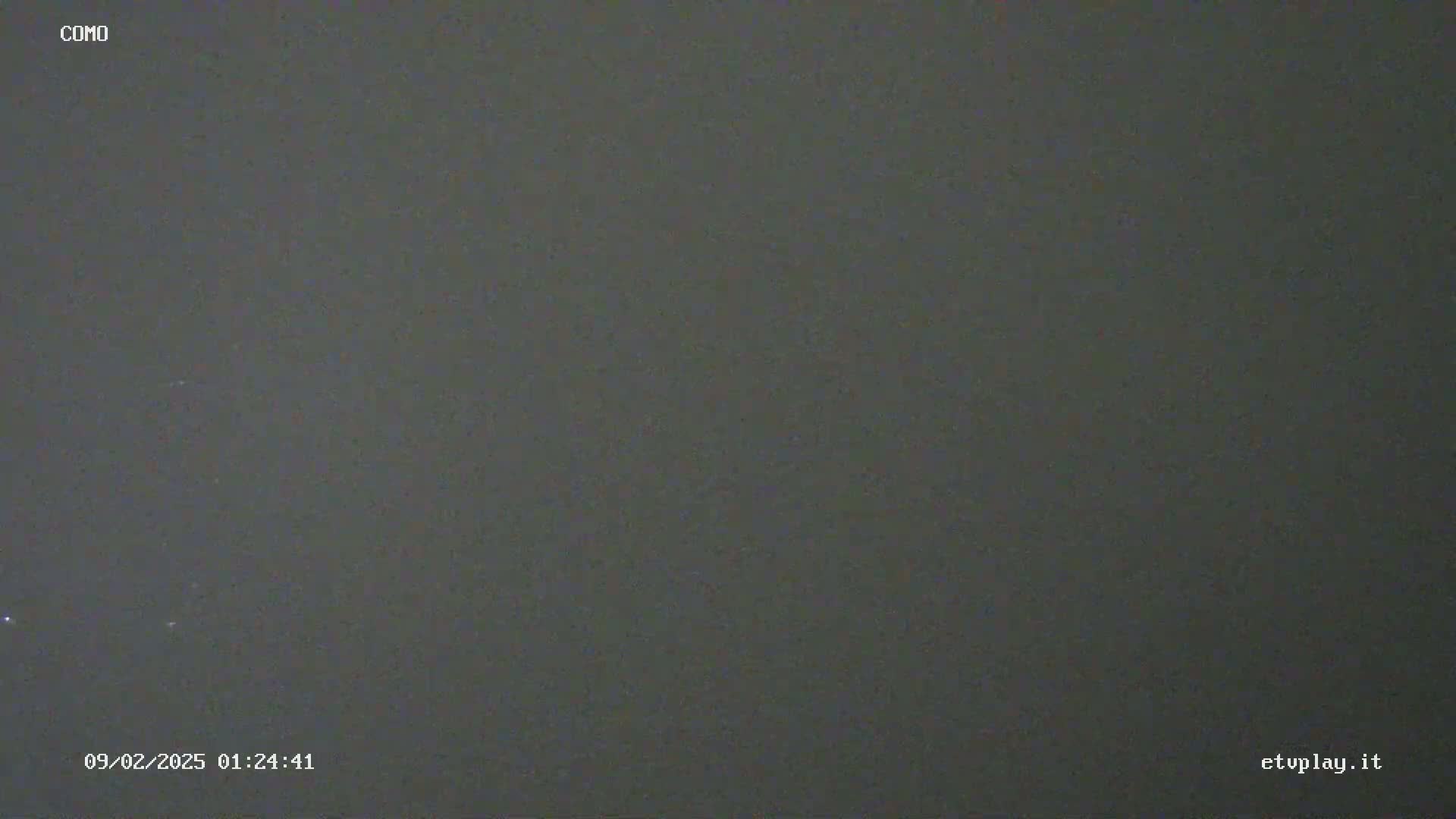 A dark gray, mostly featureless image depicts a nighttime sky.