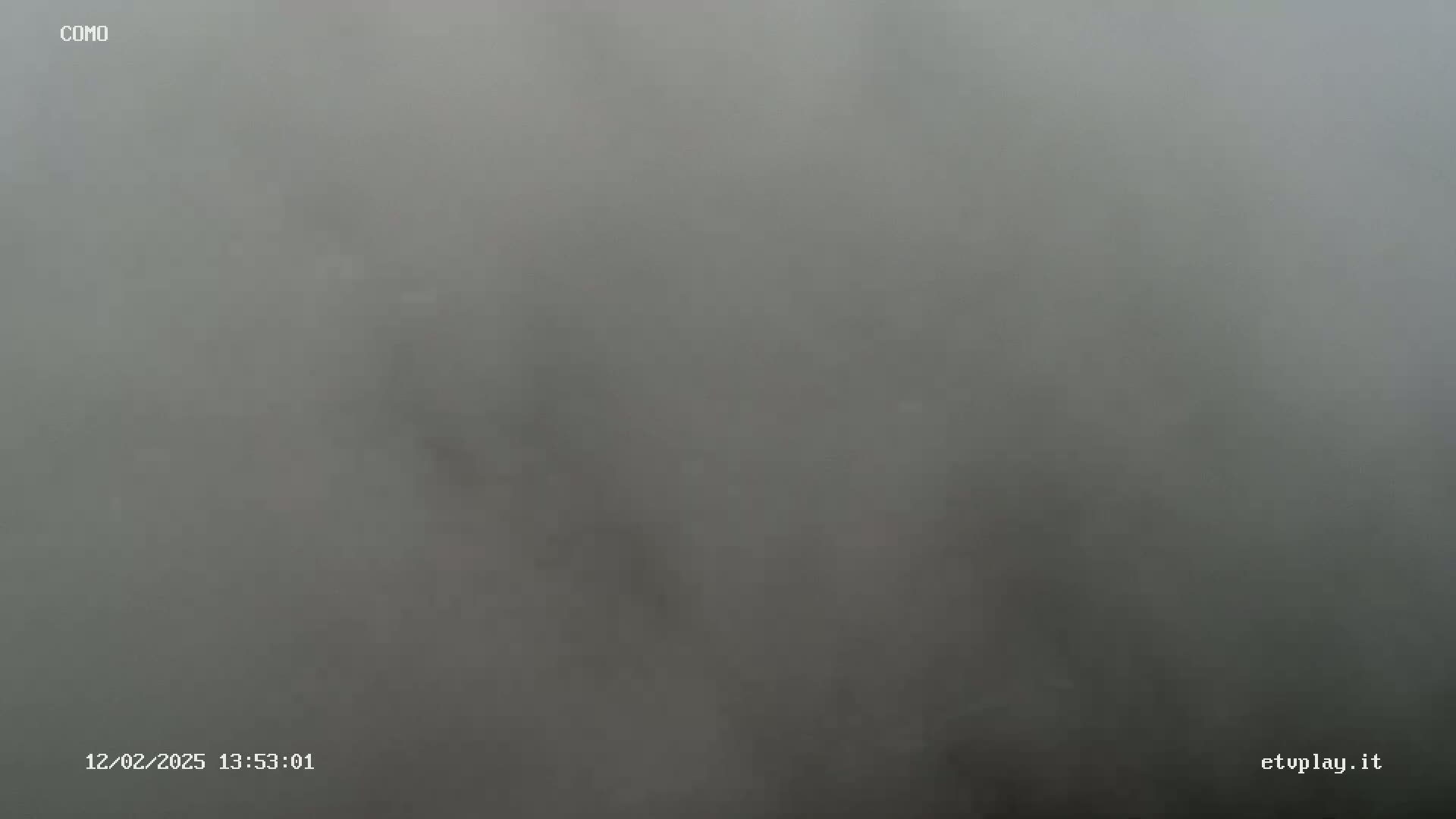 A very foggy or hazy gray scene is visible.