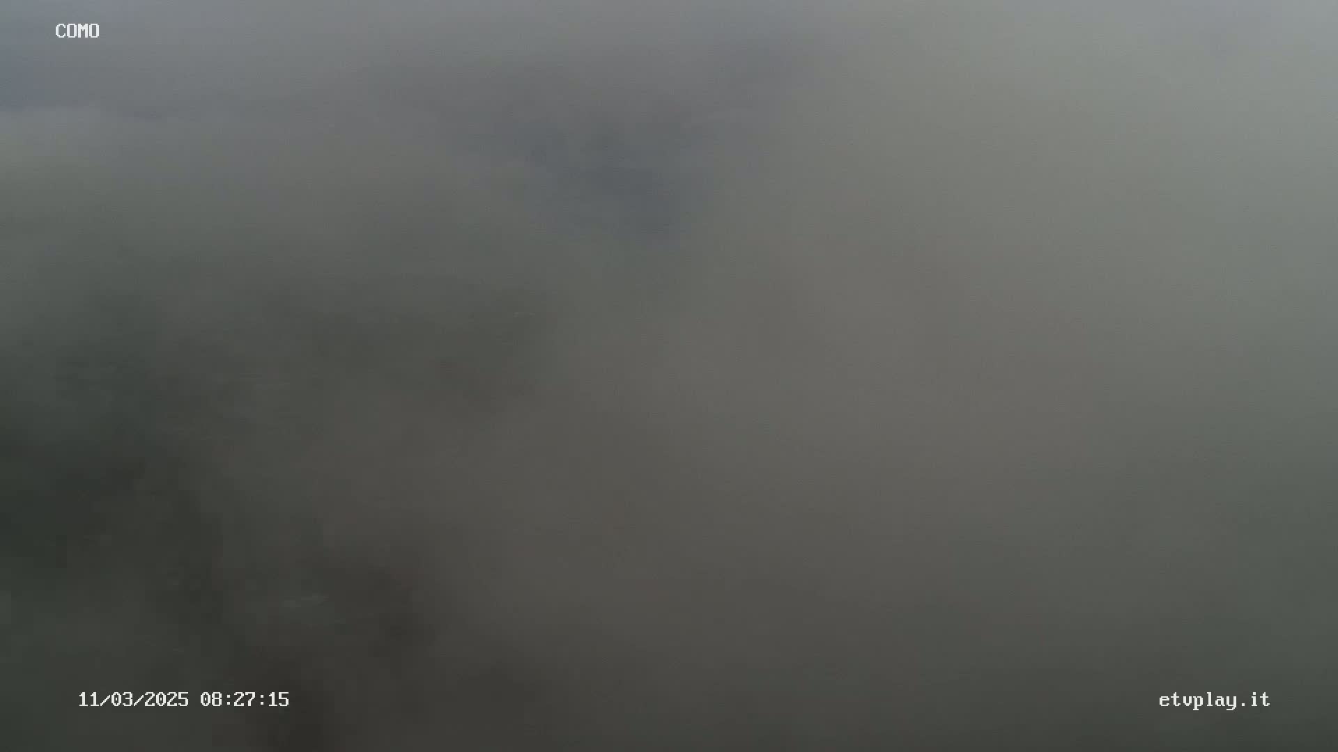 A very foggy or hazy outdoor scene is visible.