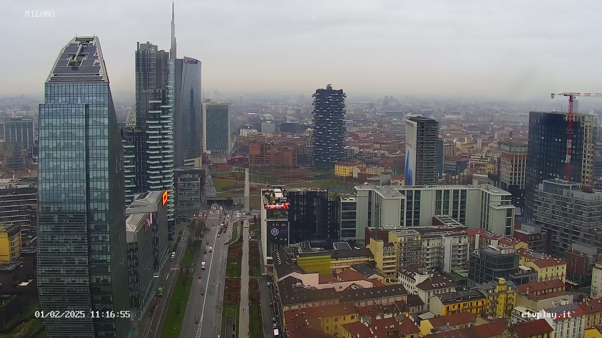 A city skyline with numerous skyscrapers under an overcast sky.