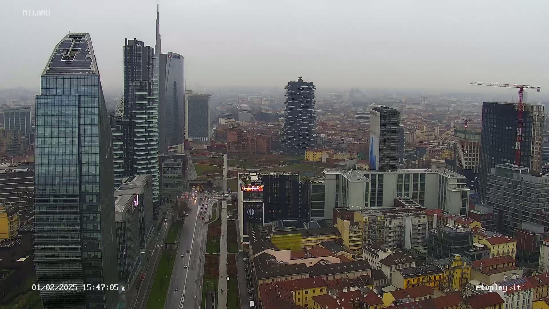 A city skyline of numerous skyscrapers and high-rise buildings under an overcast sky.
