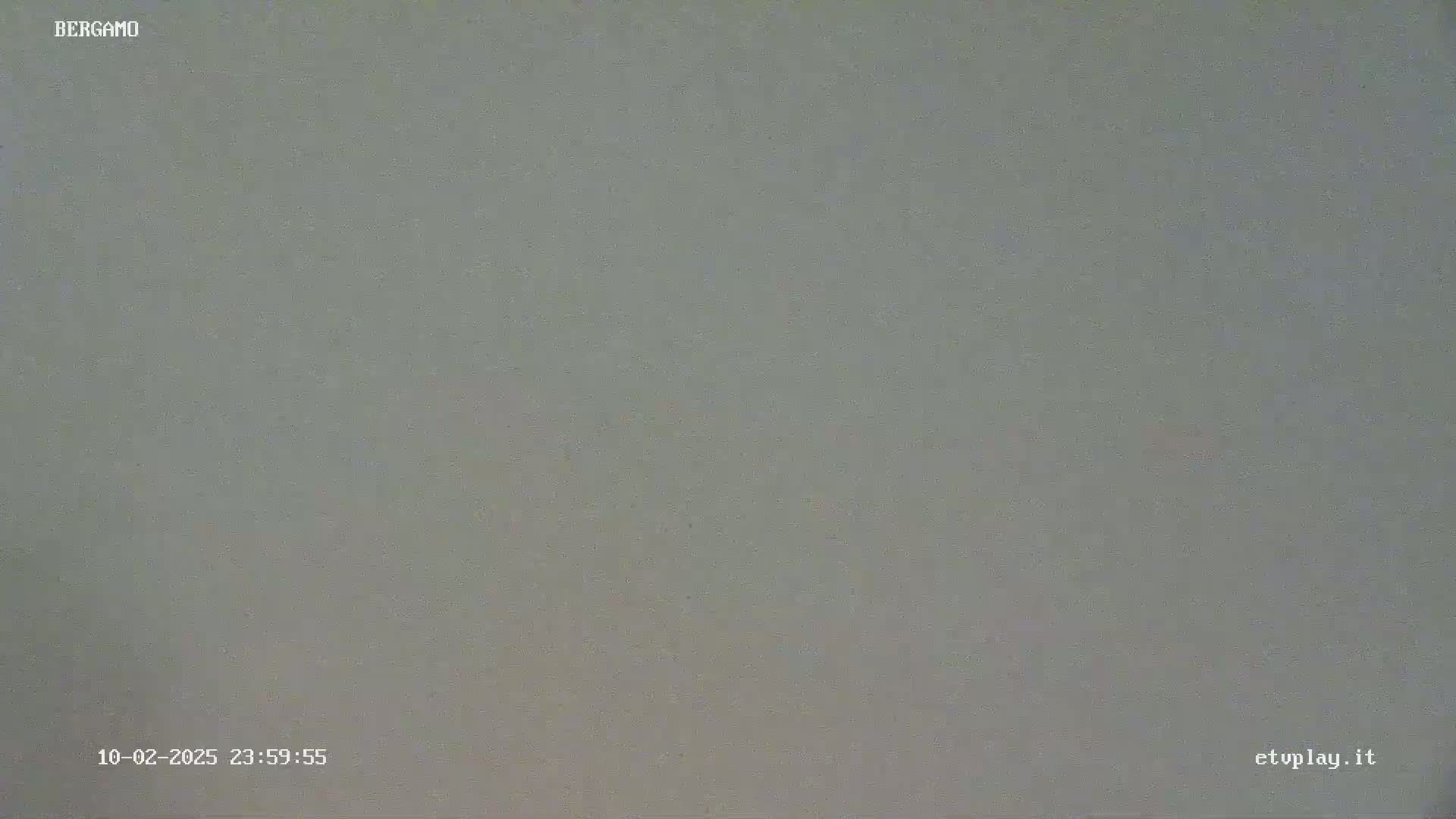 The image shows a solid, muted gray surface.