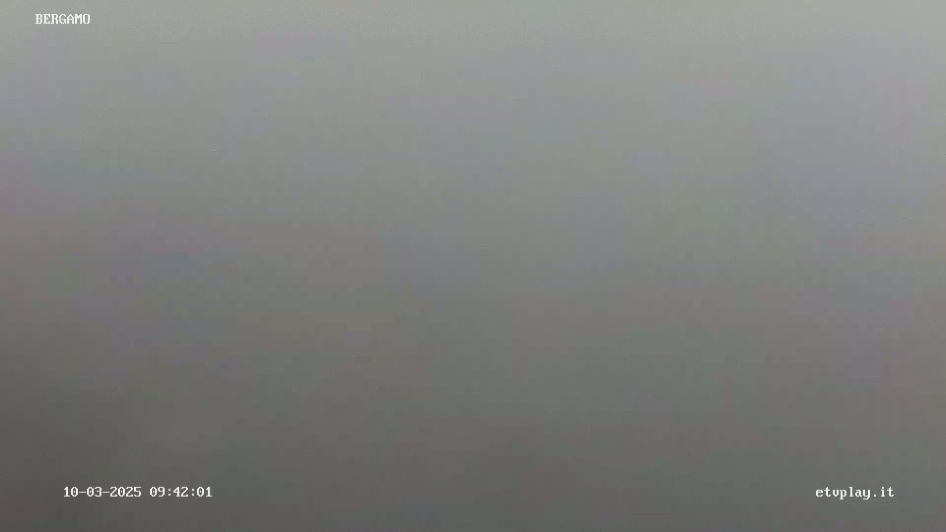 A gray, foggy scene is visible.