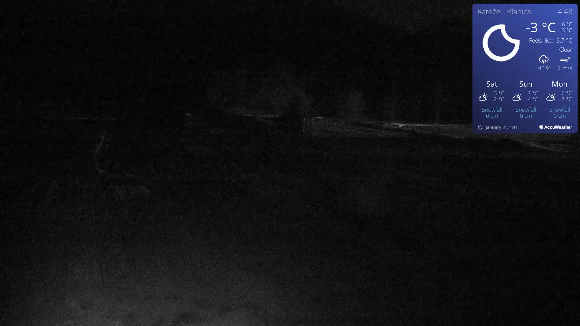 A dark, nighttime outdoor scene shows a flat, empty landscape under a clear sky.