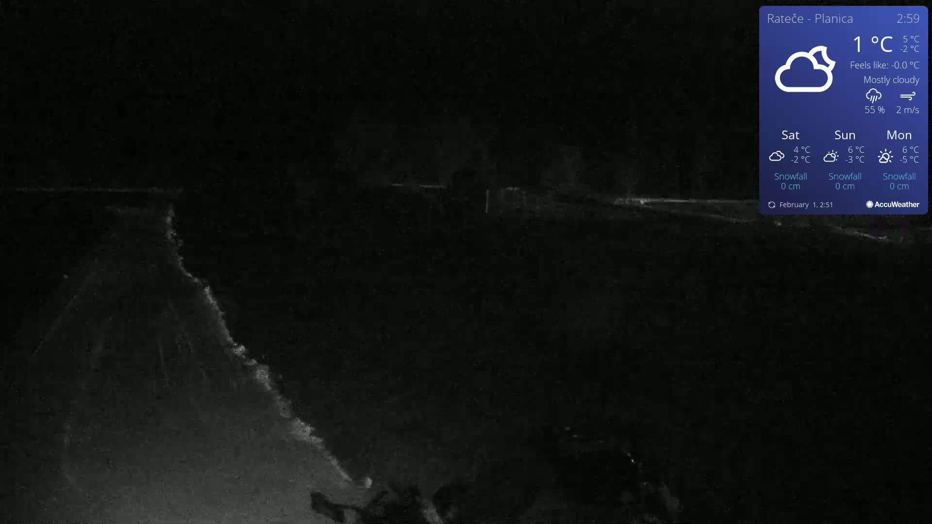 A mostly cloudy night scene shows a dark road or path under a 1°C temperature.