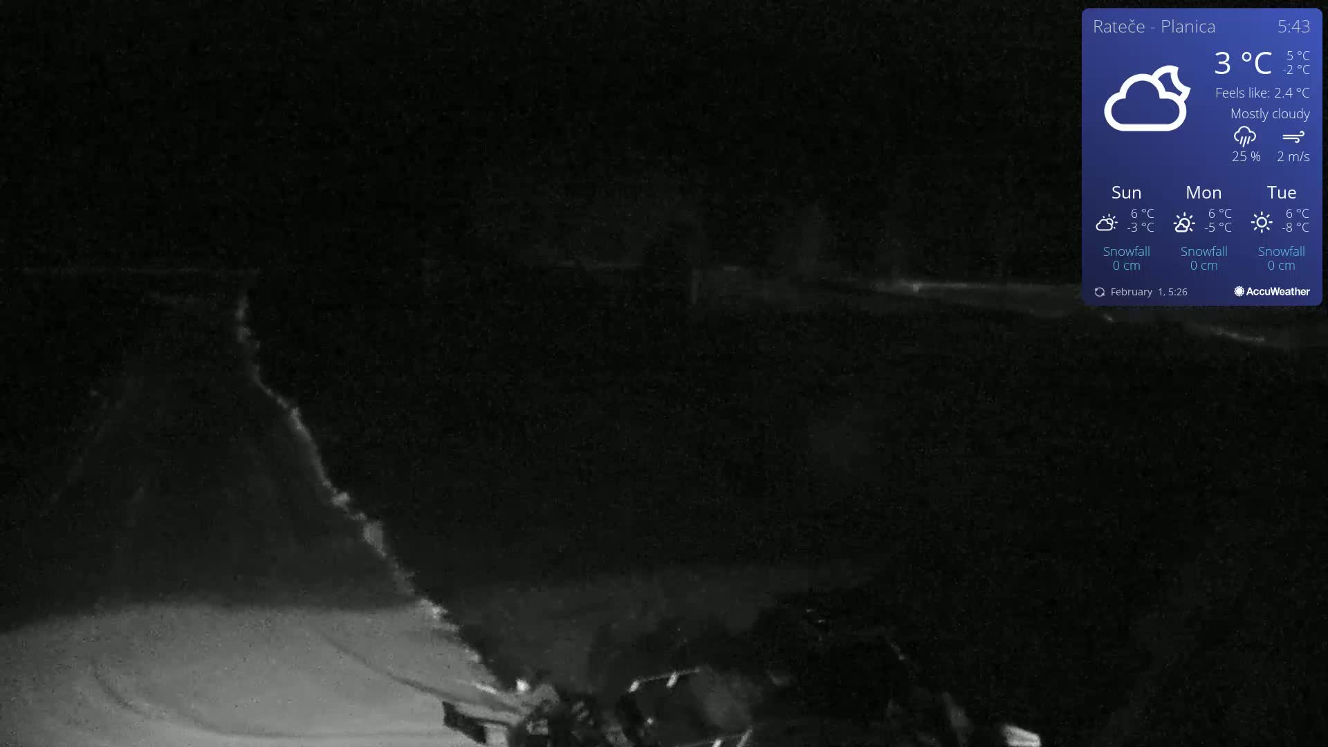 A mostly cloudy nighttime scene shows a snow-covered area with a dimly lit object in the bottom right corner, under a temperature of 3°C.