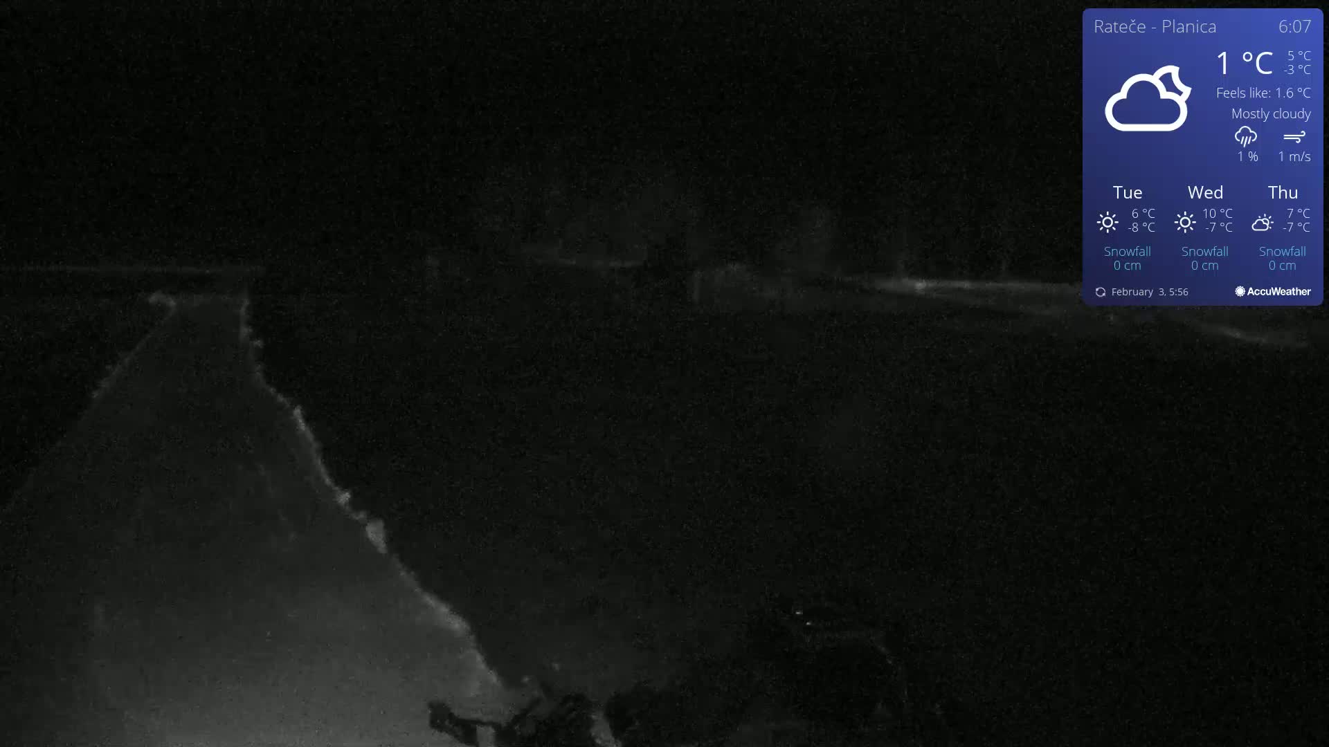 A nighttime, mostly cloudy scene shows a dark, snow-covered road or path under a 1°C temperature.