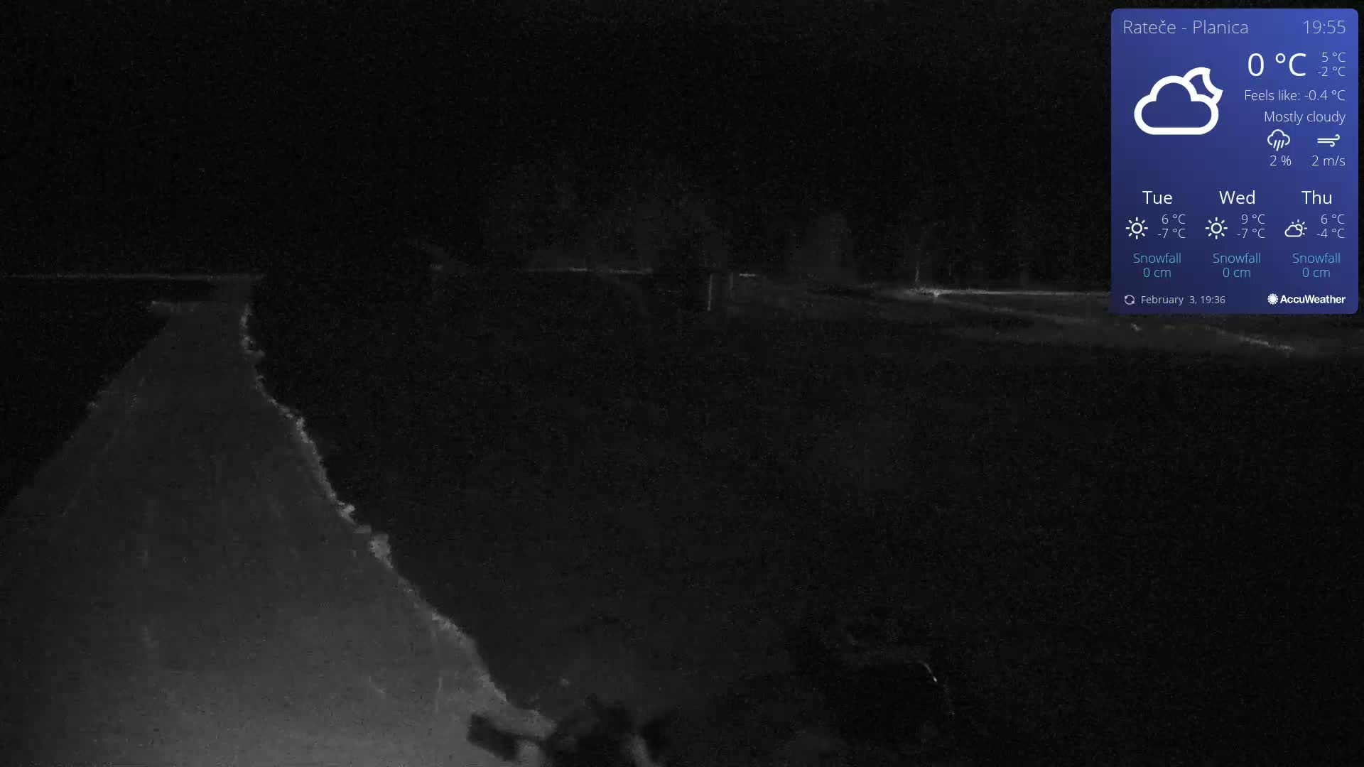A nighttime, mostly cloudy scene shows a dark road or path under a 0°C temperature.