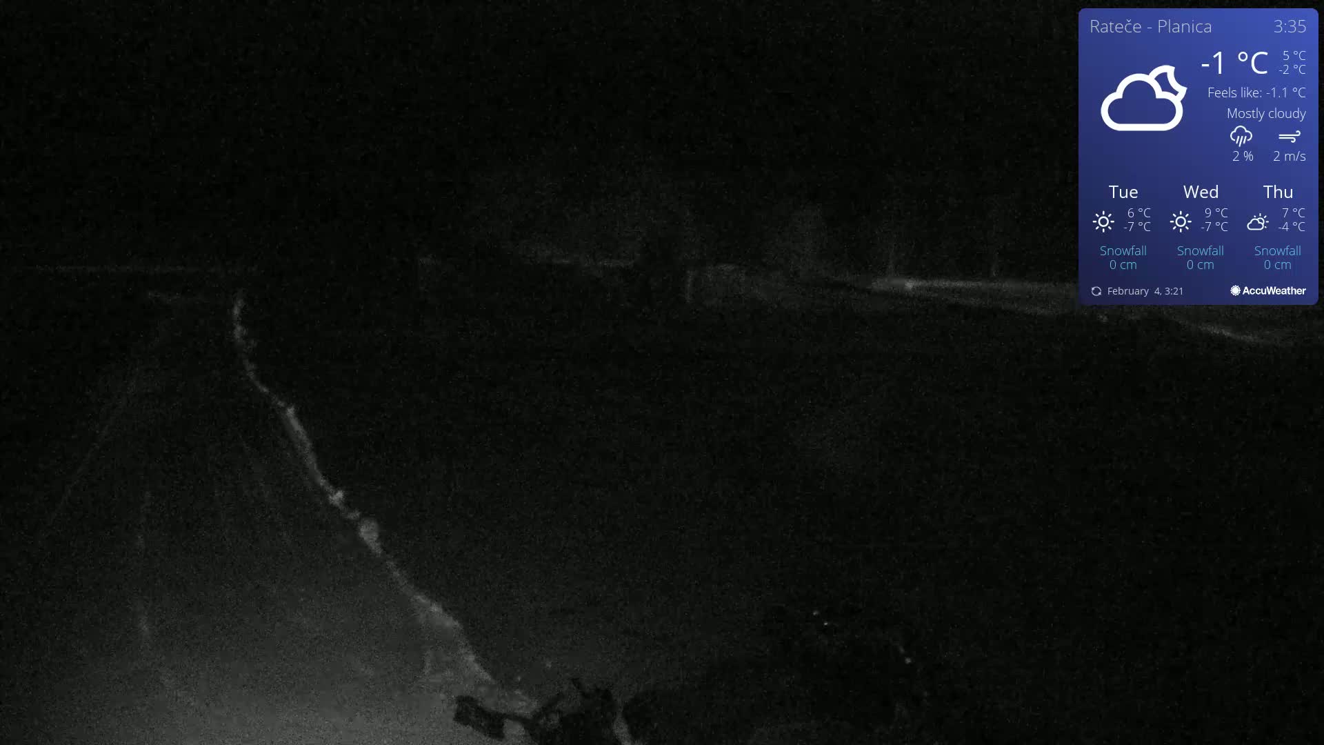 A mostly cloudy night scene shows a dark road and some faint light in the distance, with a temperature of -1°C.