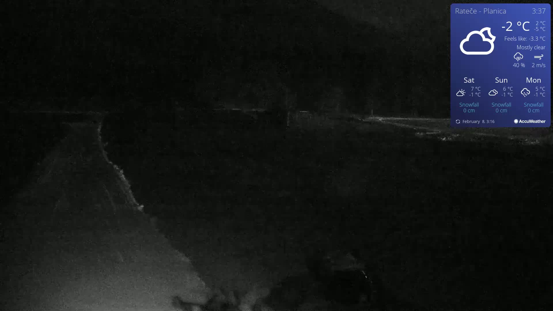 A mostly clear night scene shows a dark road curving into the distance under a -2°C temperature.