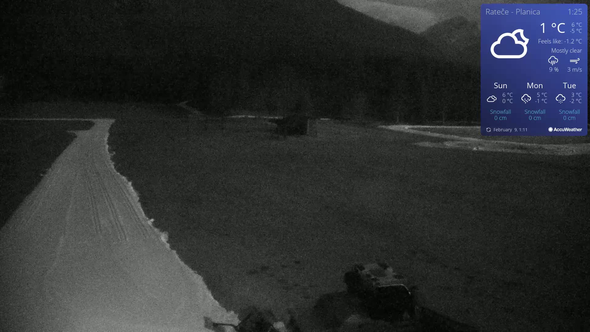 A snow-covered path winds through a dark, mostly clear night scene under a 1°C temperature.