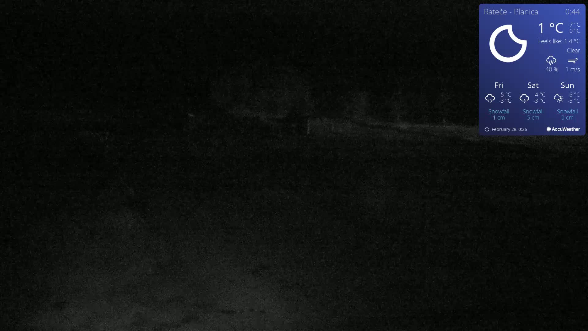 A dark, nighttime outdoor scene under clear skies with a temperature of 1°C.
