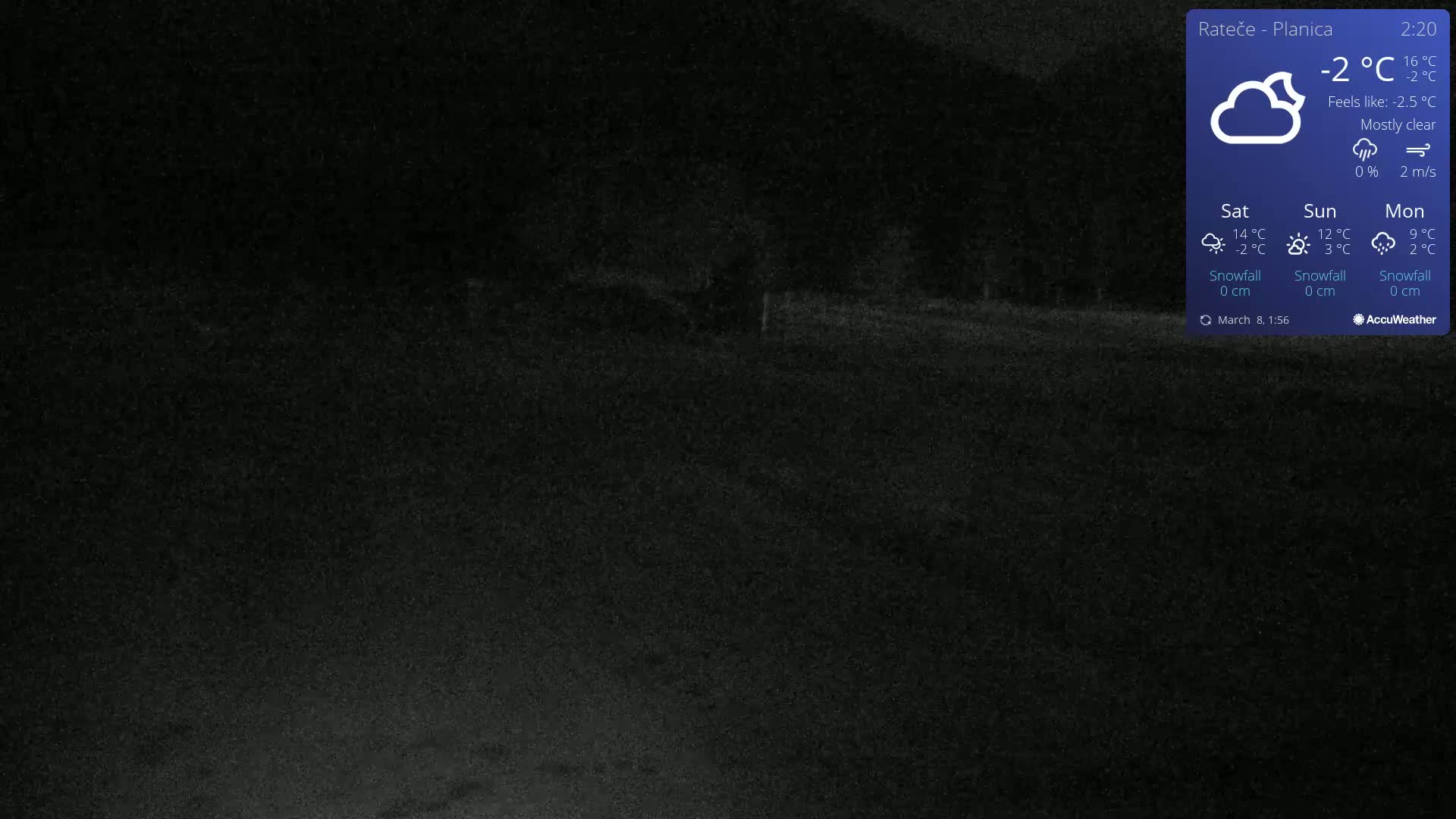 A mostly clear, dark night scene shows a flat expanse of land with sparse vegetation under a -2°C temperature.