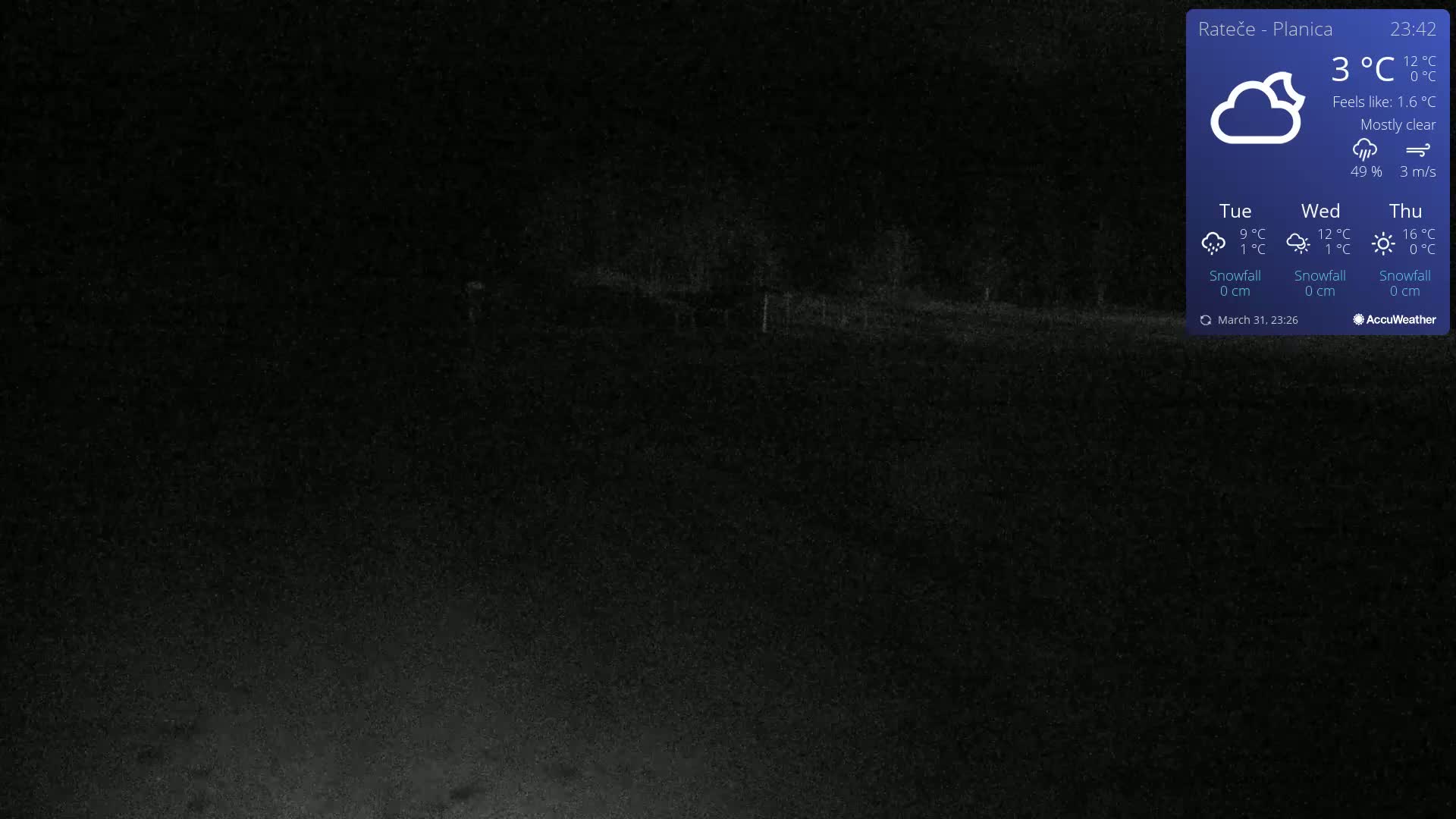 A mostly clear night scene shows a dark roadway and indistinct land features under a 3°C temperature.