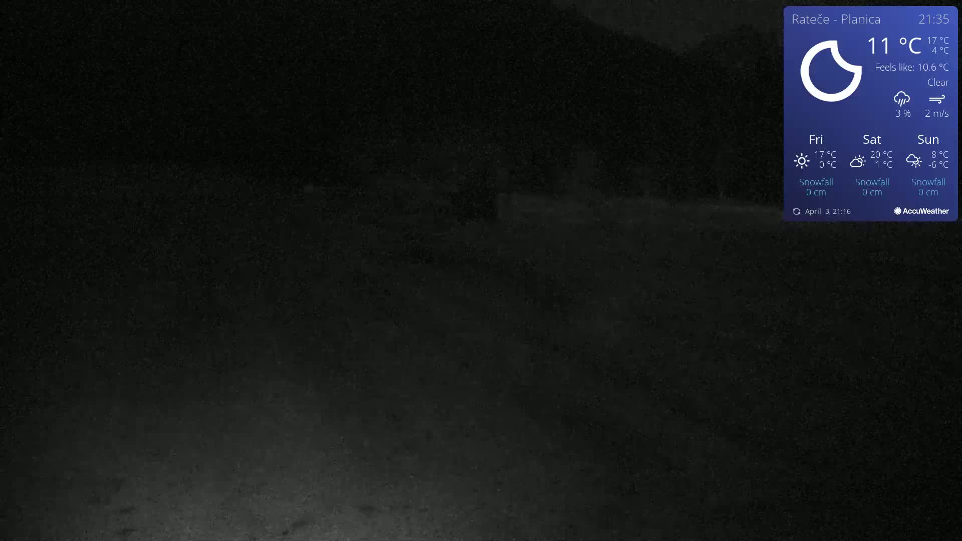 A dark, nighttime outdoor scene shows a clear sky with a slight breeze.