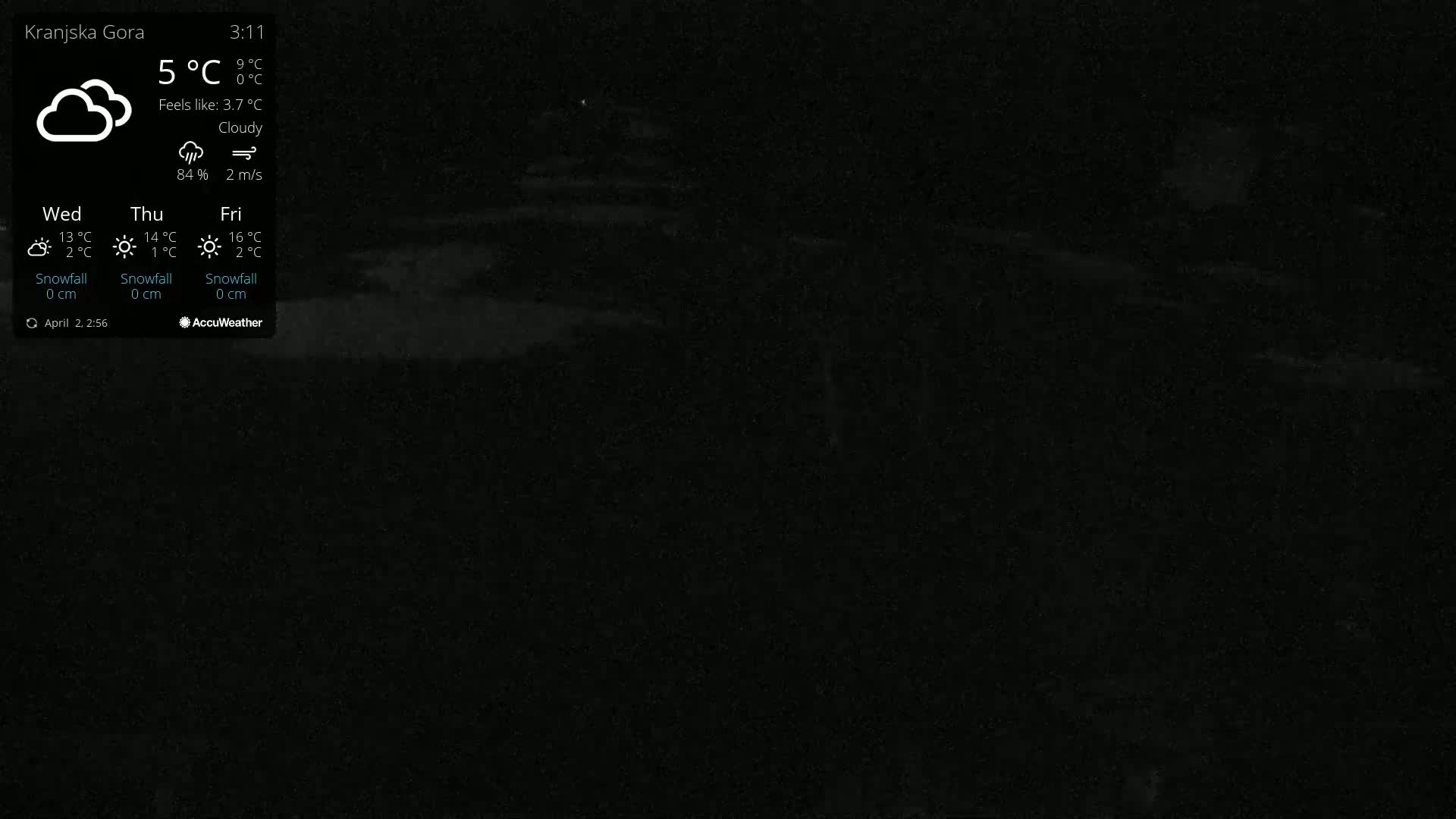 A mostly dark image shows a cloudy night with a temperature of 5°C and a light wind.
