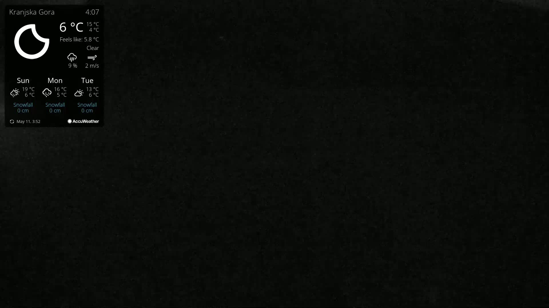 A dark gray or black background shows a weather widget indicating clear skies and a temperature of 6°C.