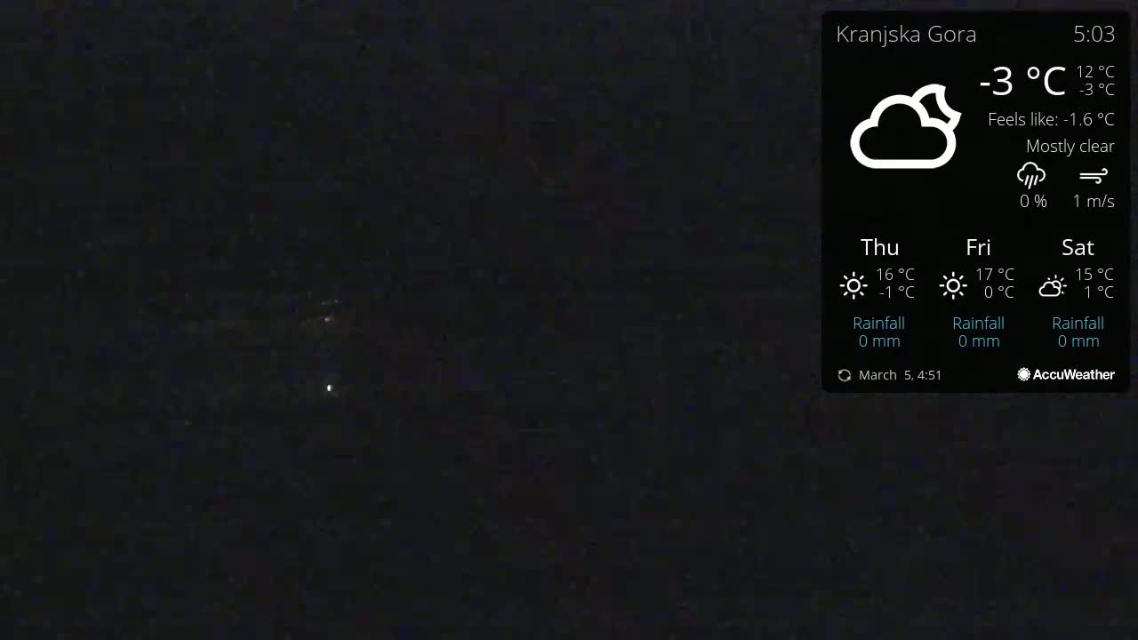 A mostly clear night sky is visible, showing a few faint lights in the distance, with a temperature of -3°C.