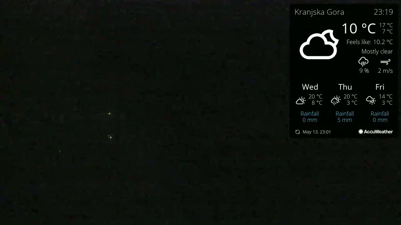 A mostly clear night sky with a few distant lights is visible, under a temperature of 10°C.