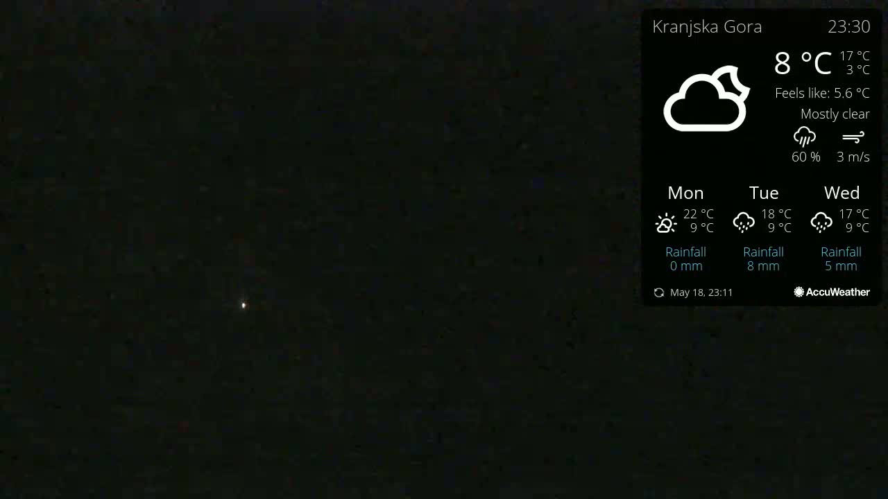 A mostly clear night sky with a single bright star visible.