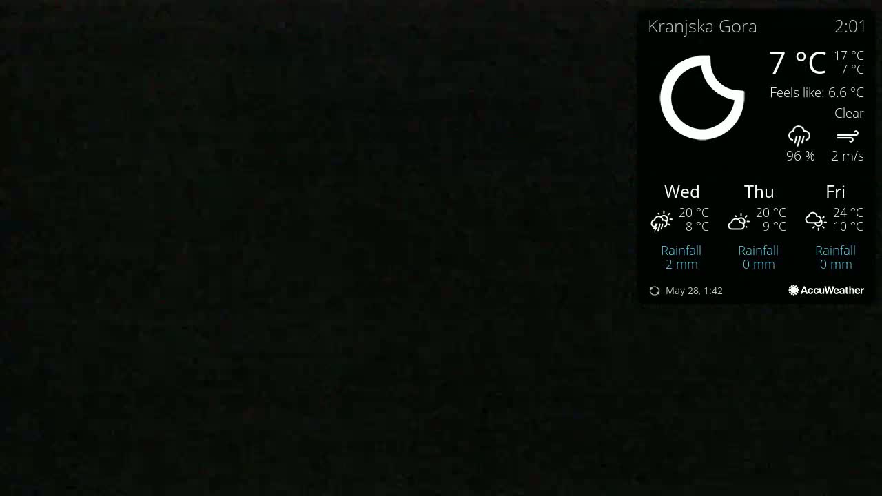A dark background displays a weather forecast showing clear skies and a temperature of 7°C.