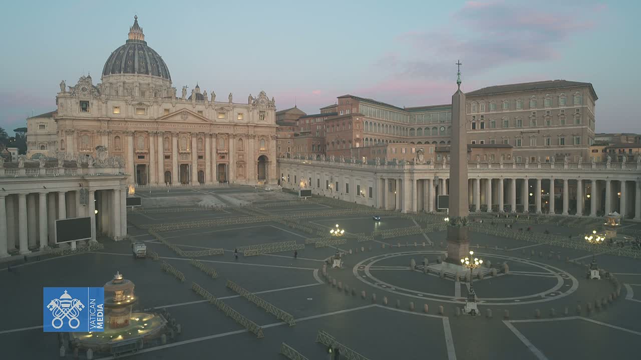 St. Peter's Square in Vatican City is largely empty under a twilight sky.