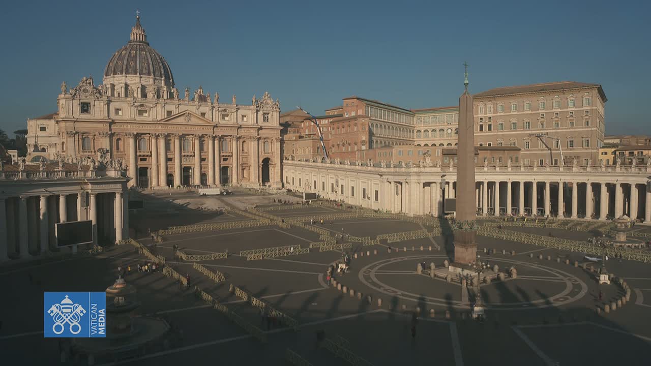 St. Peter's Basilica and Square in Vatican City are shown on a sunny day with sparse crowds and barriers in place.
