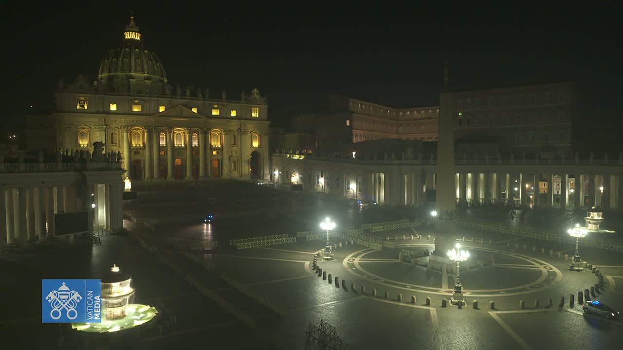 St. Peter's Basilica and Square are illuminated at night, appearing empty under a dark sky.