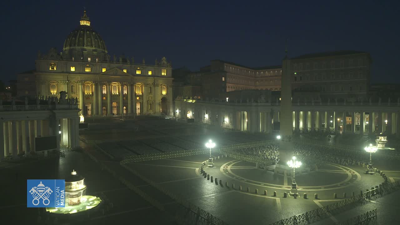 St. Peter's Basilica and Square at night, illuminated, with a mostly empty plaza.