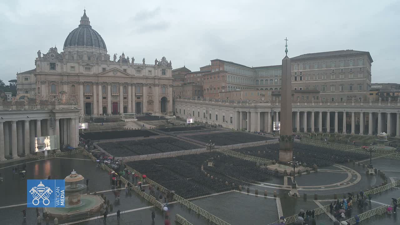A wet St. Peter's Square in Vatican City shows many empty chairs set up before St. Peter's Basilica under an overcast sky.