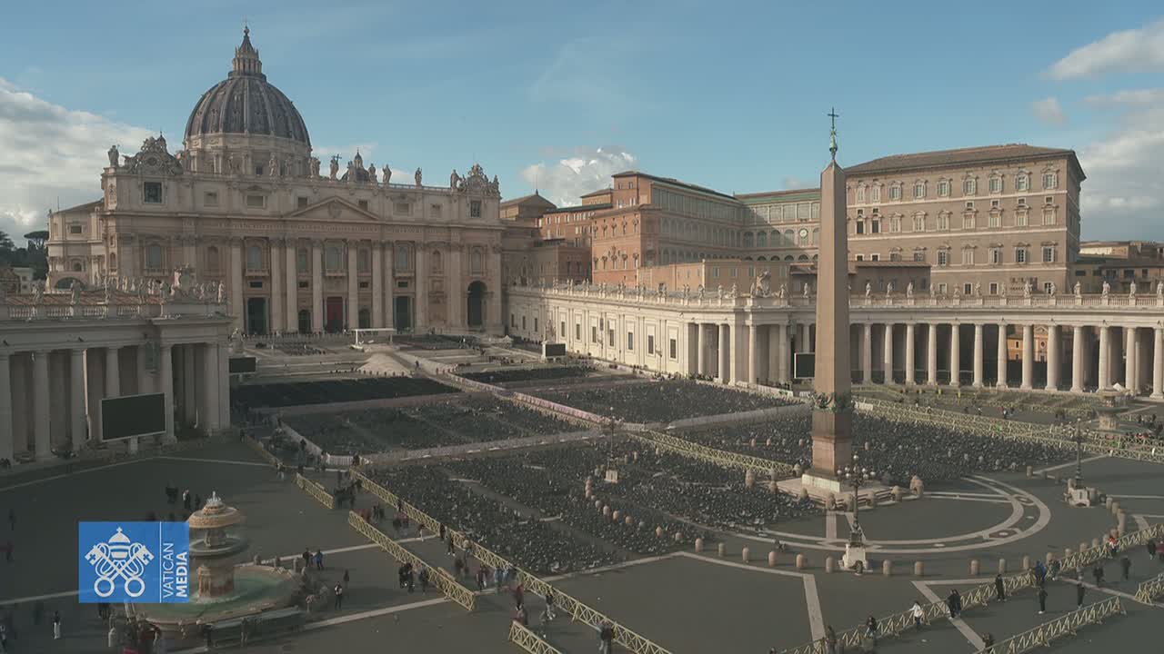St. Peter's Square in Vatican City is filled with chairs under a mostly sunny sky.