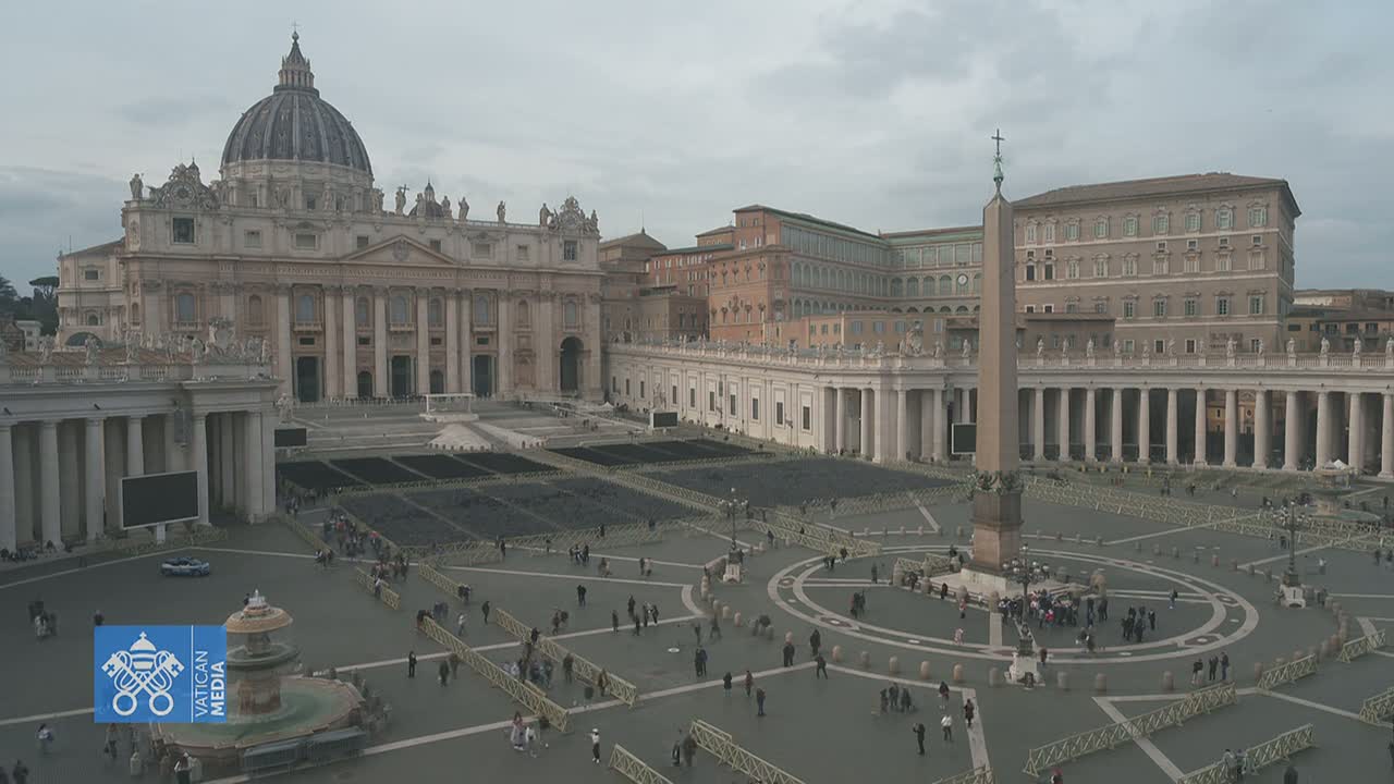 A mostly empty St. Peter's Square in Vatican City is seen on an overcast day, with St. Peter's Basilica in the background.