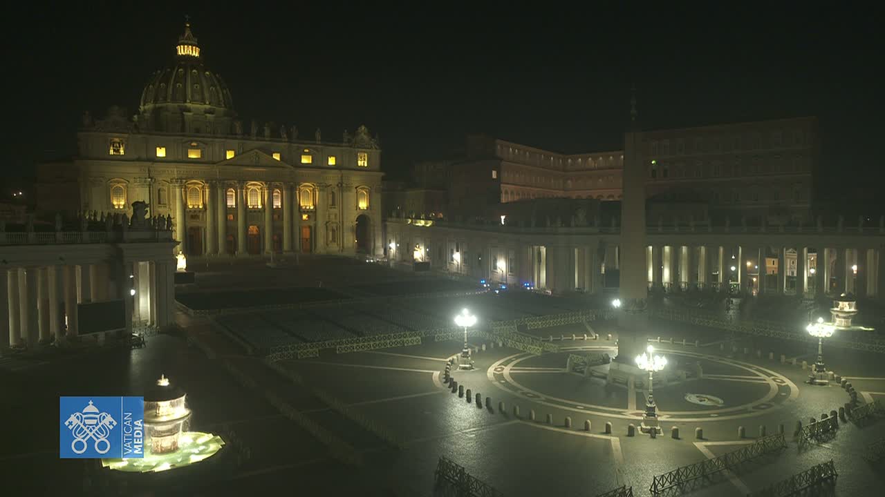 St. Peter's Basilica and St. Peter's Square are illuminated at night, appearing mostly empty under a dark sky.