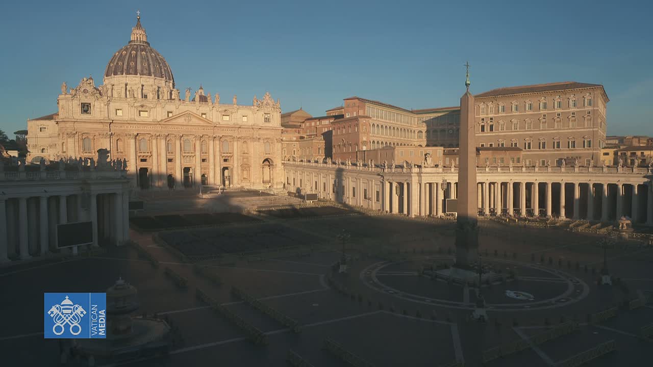 St. Peter's Basilica and Square in Vatican City are shown at sunrise on a clear day.