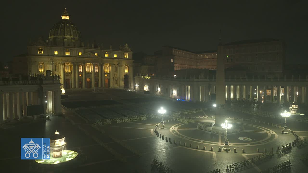 St. Peter's Basilica and Square are illuminated at night, appearing mostly empty under a dark sky.