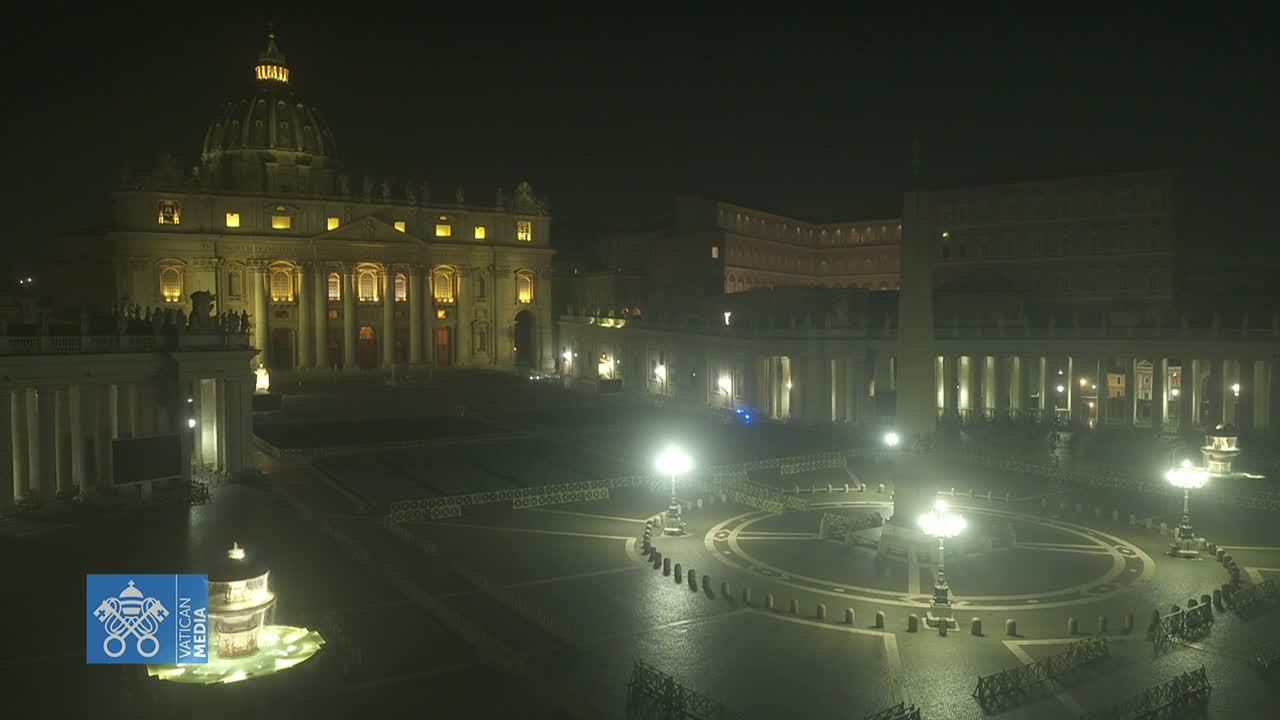 St. Peter's Basilica and St. Peter's Square are illuminated at night, appearing mostly empty under a dark sky.